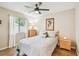 Bedroom featuring tiled floors, a ceiling fan, and natural light at 145 Lakeside Cir, Sanford, FL 32773