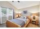 Cozy bedroom with a comfortable bed, bedside tables, and natural light at 145 Lakeside Cir, Sanford, FL 32773