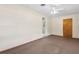 Carpeted bedroom featuring a ceiling fan and doorway leading to another room at 146 Mills Rd, Deland, FL 32724
