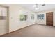 Bedroom with carpet, ceiling fan and natural light from large windows at 146 Mills Rd, Deland, FL 32724