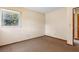Bedroom with neutral paint, carpet, and a window offering natural light at 146 Mills Rd, Deland, FL 32724