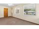 Bedroom with a carpeted floor, ceiling fan, and natural light from large windows at 146 Mills Rd, Deland, FL 32724