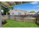 Fenced backyard providing privacy and a safe play area for children or pets, with green lawn and surrounding greenery at 1639 Choctaw Trl, Maitland, FL 32751