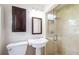 Bathroom with stall shower with glass doors, pedestal sink, medicine cabinet at 1639 Choctaw Trl, Maitland, FL 32751