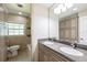 Bathroom featuring double sinks, a tub and shower, tile floors, and ample storage at 1639 Choctaw Trl, Maitland, FL 32751