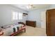 Bedroom with carpet, ceiling fan, shutters, and chest of drawers at 1639 Choctaw Trl, Maitland, FL 32751