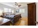 Bedroom with hardwood floors, a ceiling fan, and natural light at 1639 Choctaw Trl, Maitland, FL 32751