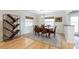 Bright dining room featuring a wooden table and chairs, custom bookshelf, and natural light at 1639 Choctaw Trl, Maitland, FL 32751