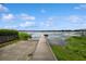 Long wooden dock extending into the calm waters, perfect for boating, fishing, and enjoying waterfront living at 1639 Choctaw Trl, Maitland, FL 32751
