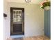 Front door with a brick exterior, brick pavers, and flower pot at 1639 Choctaw Trl, Maitland, FL 32751