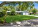 Beautiful single-story home with a two-car garage, landscaped lawn, and a tree-lined street at 1639 Choctaw Trl, Maitland, FL 32751