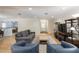 Inviting living room featuring wood floors, a comfortable gray sofa, and an open layout at 1639 Choctaw Trl, Maitland, FL 32751