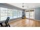 Bright living room with hardwood floors and a view of the outdoor pool at 1639 Choctaw Trl, Maitland, FL 32751