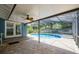 Screened-in pool with brick patio and ceiling fan at 1639 Choctaw Trl, Maitland, FL 32751