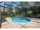 Screened-in pool with spa and brick patio at 1639 Choctaw Trl, Maitland, FL 32751