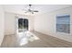 Sunny bedroom with a sliding glass door offering backyard access at 16603 Corner Lake Dr, Orlando, FL 32820