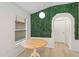 Dining area features decorative green wall, window, and simple chandelier at 16603 Corner Lake Dr, Orlando, FL 32820