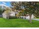 Landscaped front yard with a beautiful magnolia tree offers great curb appeal at 16603 Corner Lake Dr, Orlando, FL 32820