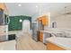Bright kitchen with stainless steel appliances, natural wood cabinets, and breakfast nook at 16603 Corner Lake Dr, Orlando, FL 32820
