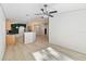 Open-concept living space with updated flooring at 16603 Corner Lake Dr, Orlando, FL 32820
