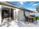 Outdoor patio featuring a sliding glass door, outdoor dining table and grill for entertaining at 16603 Corner Lake Dr, Orlando, FL 32820