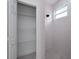 Bright bathroom with white tile walls, shower and a view of an open closet at 1868 14Th St, Orange City, FL 32763