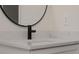 Bathroom with vanity and white marbled countertops and a matte black faucet at 1868 14Th St, Orange City, FL 32763