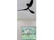 Bright bedroom showing modern ceiling fan and a sliding door with backyard view at 1868 14Th St, Orange City, FL 32763