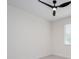 Bright bedroom features soft carpeting and a modern fan at 1868 14Th St, Orange City, FL 32763