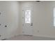 Bright entryway featuring a decorative glass door and white trim at 1868 14Th St, Orange City, FL 32763