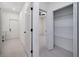 Bright hallway shows access to walk-in closet, bedroom and the front door at 1868 14Th St, Orange City, FL 32763