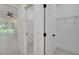 Hallway with closet and view into a bright, spacious living area at 1868 14Th St, Orange City, FL 32763