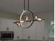 Modern kitchen light fixture with metal frame and glass accents at 1868 14Th St, Orange City, FL 32763