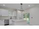 Bright, open kitchen with stainless steel appliances and a large center island at 1868 14Th St, Orange City, FL 32763