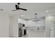 Bright kitchen with stainless steel appliances, white cabinetry and a stylish globe pendant light at 1868 14Th St, Orange City, FL 32763