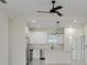 Bright kitchen featuring stainless steel appliances, modern white cabinetry, and a stylish globe pendant light at 1868 14Th St, Orange City, FL 32763
