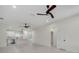 Spacious living space with modern ceiling fans, neutral paint, and an open floor plan at 1868 14Th St, Orange City, FL 32763