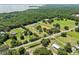 Large property featuring lake views, green pastures, multiple buildings, and a horse arena at 19630 County Road 455, Clermont, FL 34715