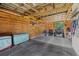 Spacious barn interior featuring wood walls and an all-terrain vehicle parked inside at 19630 County Road 455, Clermont, FL 34715