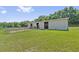 Barn for horses in a grassy field, providing shelter and access to grazing areas at 19630 County Road 455, Clermont, FL 34715