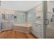 Bathroom boasts dual sinks, a soaking tub, and a separate shower, perfect for a luxurious spa-like experience at 19630 County Road 455, Clermont, FL 34715
