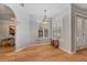 Light-filled dining area featuring wood floors, plantation shutters, and modern lighting at 19630 County Road 455, Clermont, FL 34715