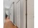 Hallway features hardwood floors and multiple doorways, providing access to different areas of the home at 19630 County Road 455, Clermont, FL 34715