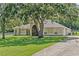 Spacious living area with wood floors and view to breakfast nook at 19630 County Road 455, Clermont, FL 34715