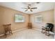 Bright bedroom with tile flooring, two windows and cozy seating, perfect for relaxation at 206 Gerry Dr, Altamonte Springs, FL 32714
