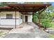 Spacious carport area providing covered parking and easy access to the home's side entrance at 206 Gerry Dr, Altamonte Springs, FL 32714
