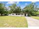 Charming single-story home with a well-manicured lawn and inviting front porch at 206 Gerry Dr, Altamonte Springs, FL 32714