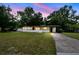 Charming single-story home featuring a well-manicured lawn and cozy front porch area at 206 Gerry Dr, Altamonte Springs, FL 32714