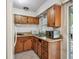 Efficient kitchen with wood cabinets and essential appliances for convenient meal preparation at 206 Gerry Dr, Altamonte Springs, FL 32714
