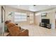 Cozy living room featuring tile floors, a large window and ample natural light at 206 Gerry Dr, Altamonte Springs, FL 32714